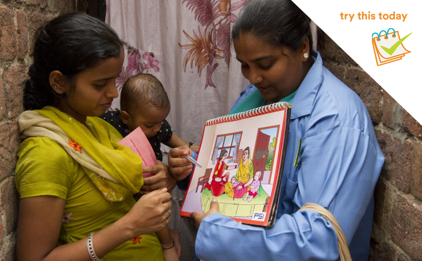 A health provider, training a new mother on health services
